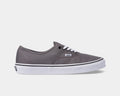 Vans Authentic shoes in gray canvas with white laces, black piping, and white rubber sole, side view.