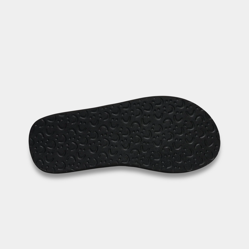 Sanuk Beer Cozy IV sandal outsole in black with textured pattern providing grip and comfort.