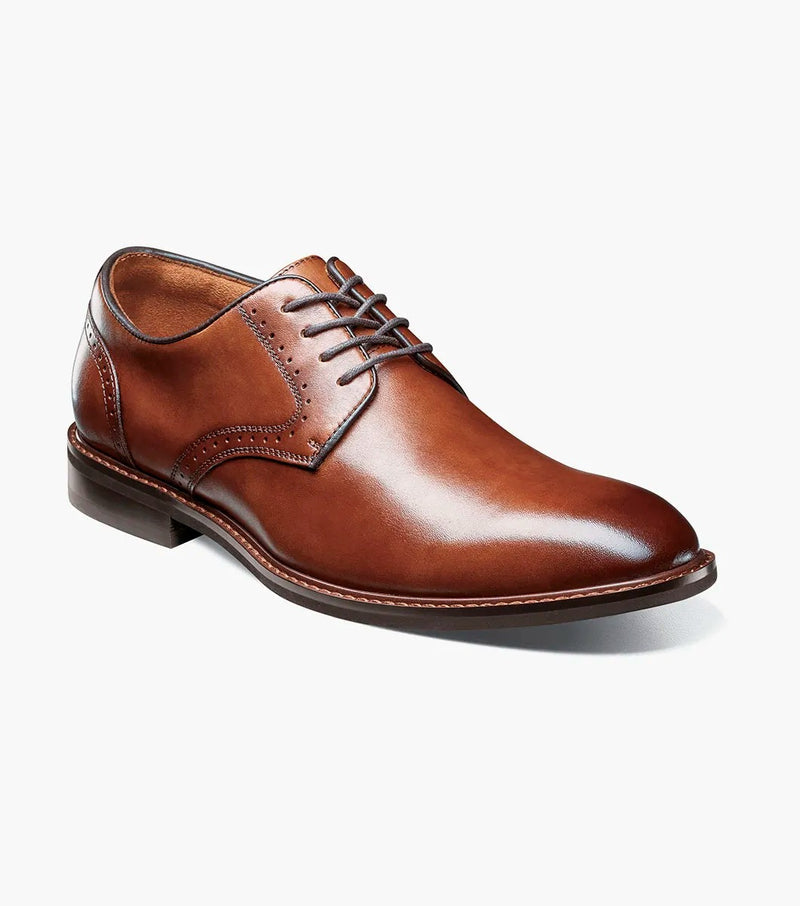 Stacy Adams Benson Plain Toe dress shoe in cognac brown leather with closed lacing and subtle stitching details, angled view.