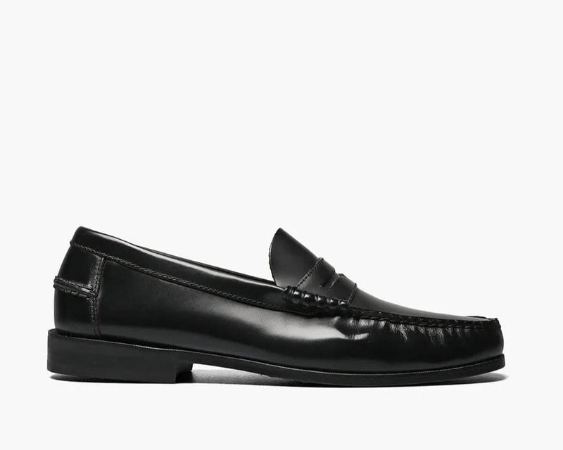 Florsheim Berkley Penny Loafer shoes in black leather with moc toe stitching and low stacked heel, side view.