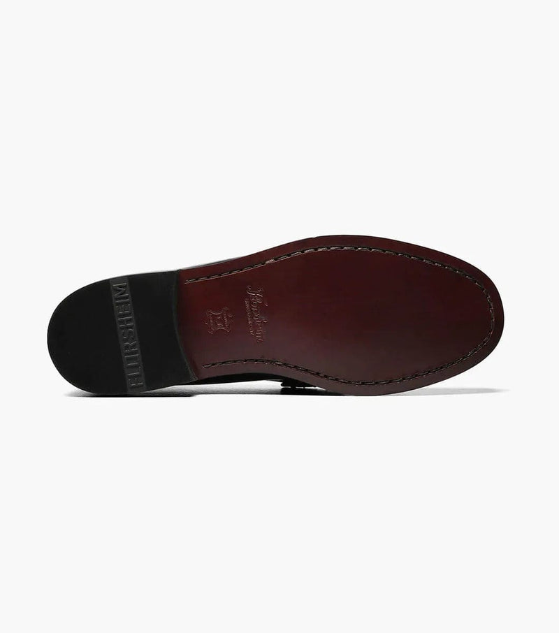 Florsheim Berkley Penny Loafer leather sole in rich brown with embossed branding and stitched detailing, bottom view.