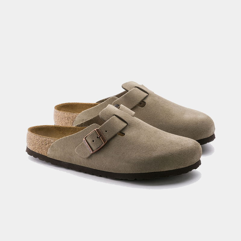 Birkenstock Boston Soft Footbed clogs in taupe suede with adjustable strap and contoured cork footbed, angled front view.