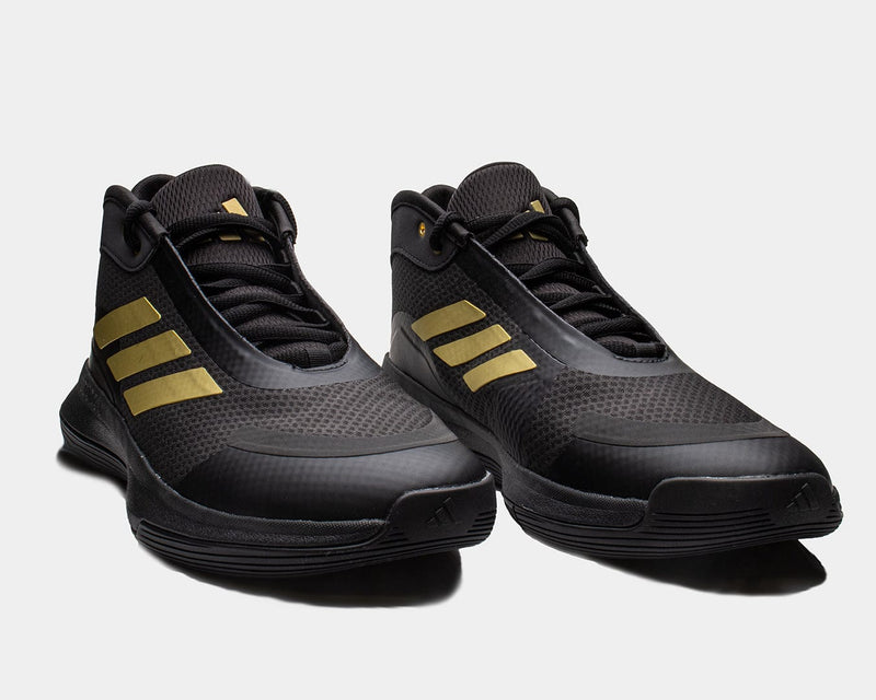 Adidas Bounce Legends athletic shoes in black with gold stripe accents, mesh upper, and rubber outsole, front angled view.
