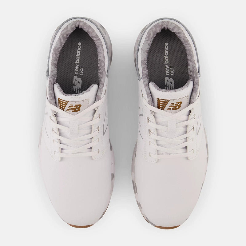 New Balance Golf Brighton Golf shoes in white with gold logo detailing and gray inner lining, top view showing lace-up closure.