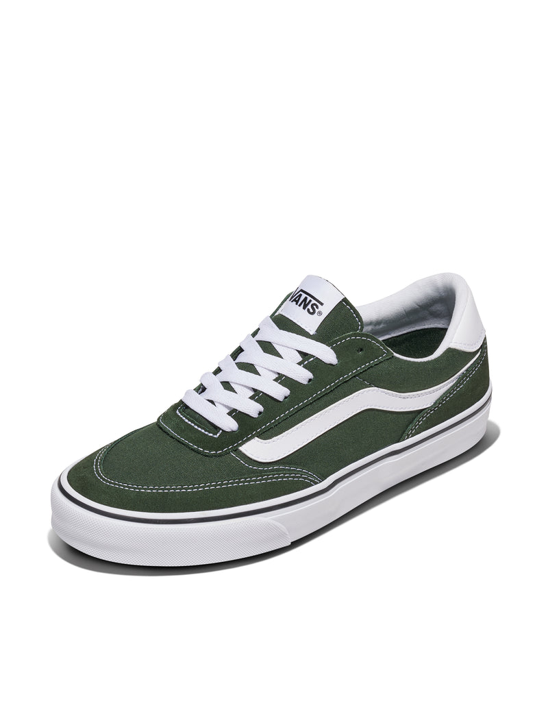Vans Brooklyn casual sneakers in dark green canvas with white side stripe, laces, and vulcanized sole, angled front view.