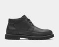 Dunham Byrne Waterproof Chukka Boot in black leather with rugged outsole, metal eyelets, and padded collar, side view.