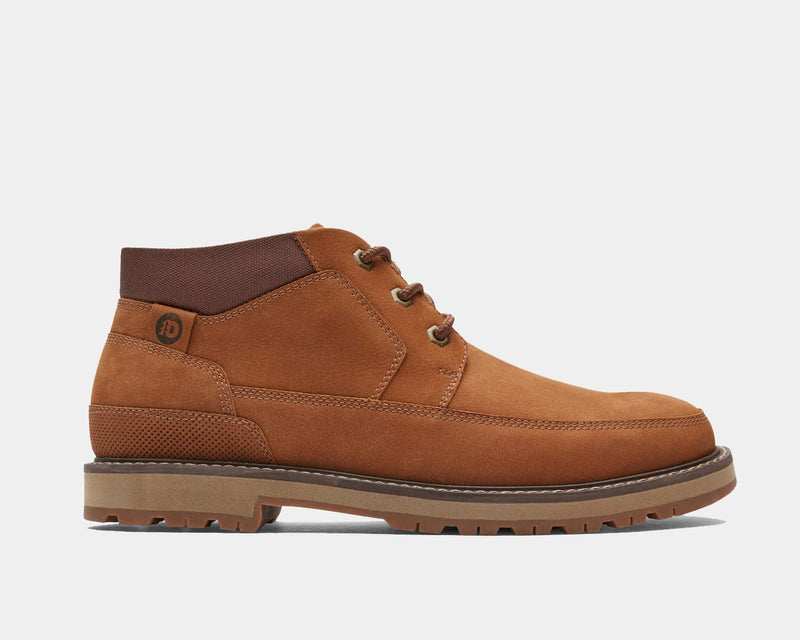 Dunham Byrne Waterproof Chukka Boot in tan leather with brown padded collar and lugged rubber outsole, side view.