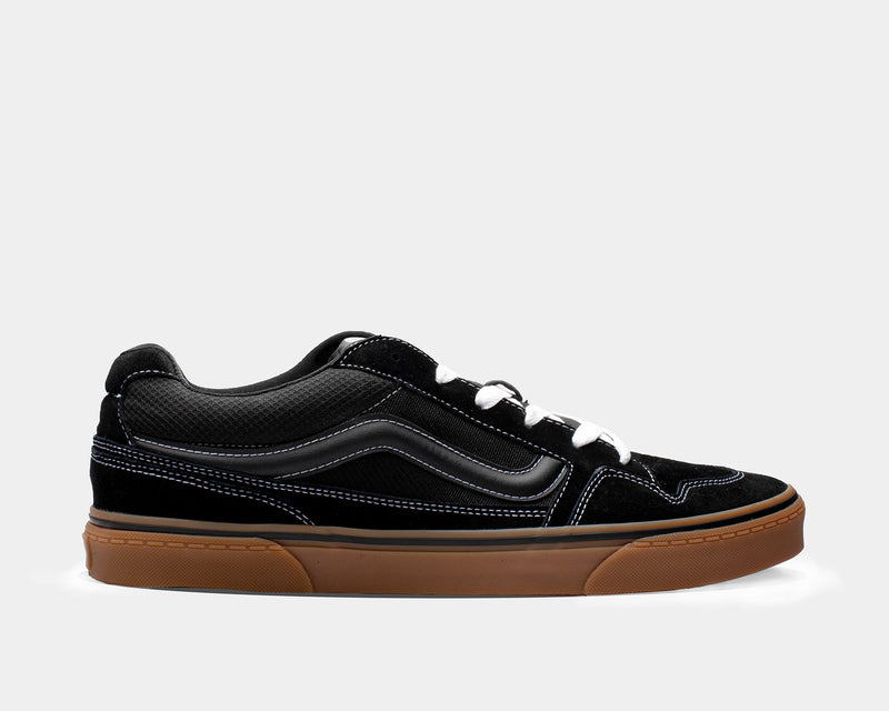 Vans Caldrone skate shoes in black with suede and mesh upper, white stitching, gum outsole, and classic stripe, side view.