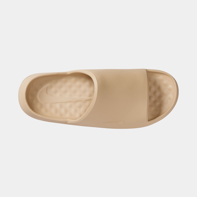 Nike Calm Slide 2.0 slides in beige with a textured footbed and single wide strap, top view.