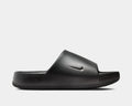Nike Calm Slide sandals in black with a sleek design, textured footbed, and subtle Swoosh logo, side profile view.