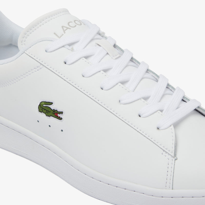 Lacoste Carnaby Set Leather Sneakers in white with embossed branding and embroidered crocodile logo, side view.
