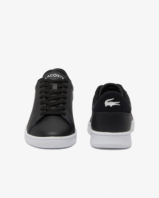 Lacoste Carnaby Set Leather Sneakers in black with white outsoles and embroidered crocodile logo, front and back view.