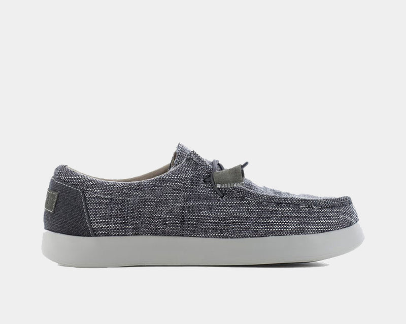Volcom Chill Composite Toe Slip-On shoes in dark gray textured fabric with slip-on design and white outsole, side view.