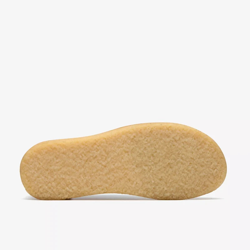 Close-up of a beige shoe sole on a white background