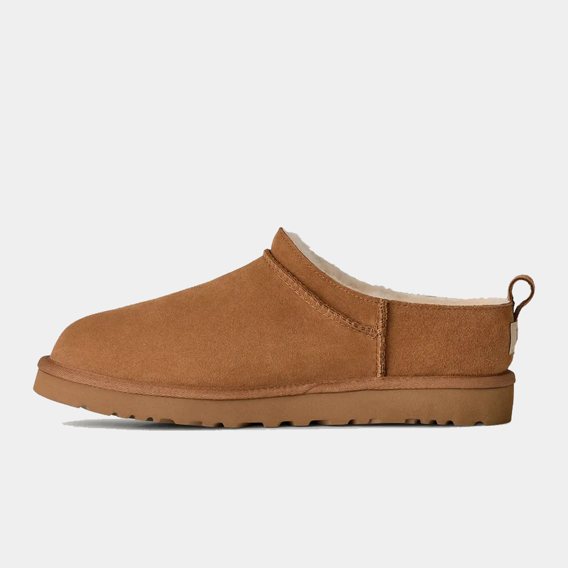 UGG Classic Micro slip-on boots in chestnut suede with sheepskin lining and rear pull tab, side view.