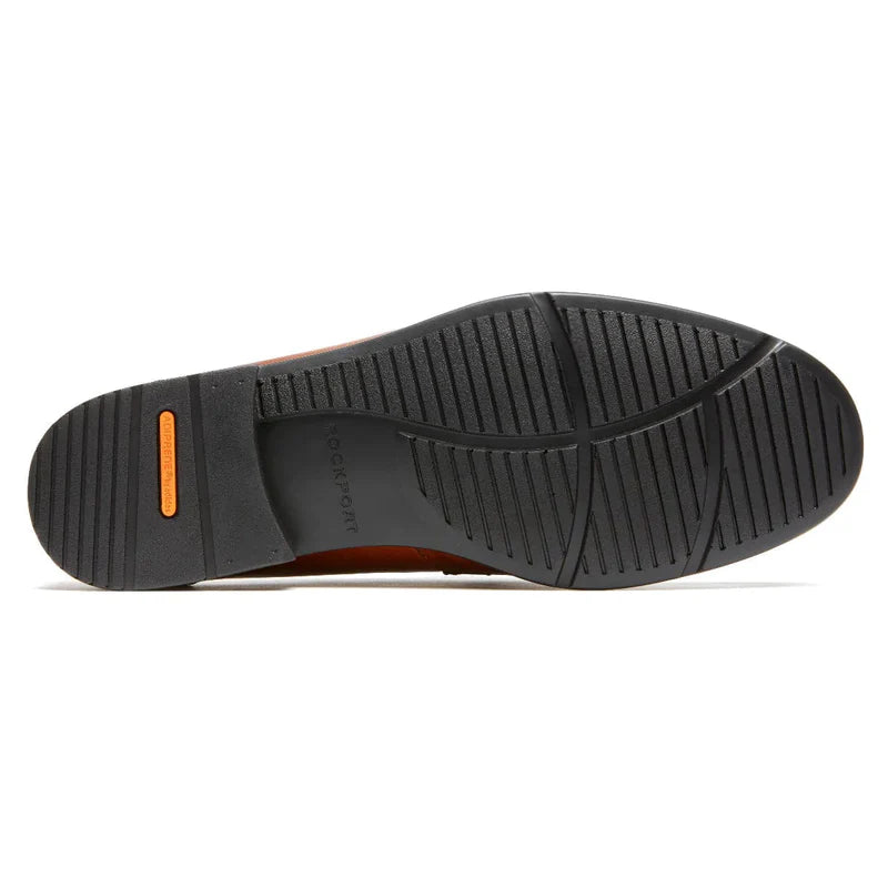 Rockport Classic Penny Loafers outsole in black rubber with textured grip pattern and orange accents, sole/bottom view.