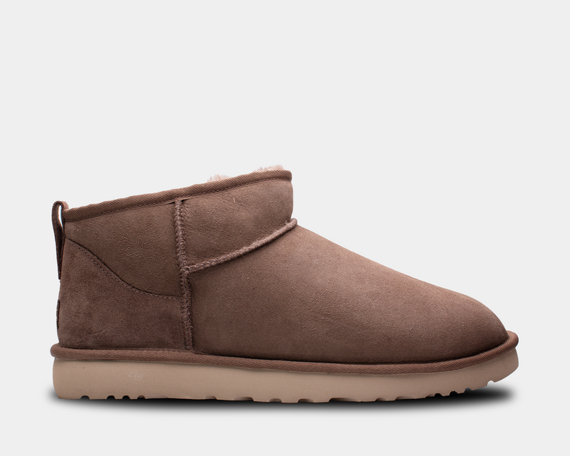 UGG Classic Ultra Mini Boot in chestnut brown with suede upper, sheepskin lining, and lightweight sole, side view.
