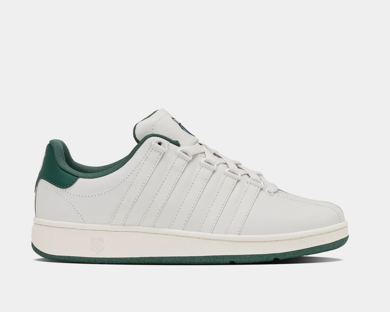 K-Swiss Classic VN sneakers in white leather with green accents and signature five-stripe design, side view.