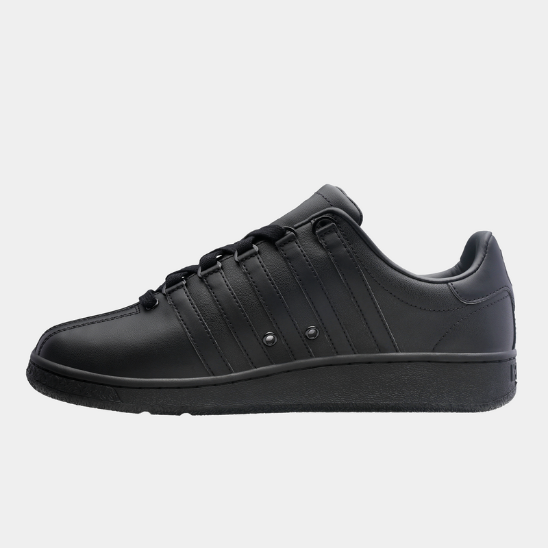 K-Swiss Classic VN sneakers in all-black leather with signature stripe details and a low-profile design, side view.