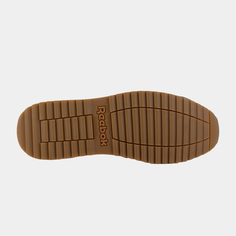 Reebok Work Classic Work Sneaker outsole in tan rubber with slip-resistant grooves and Reebok branding, sole/bottom view.