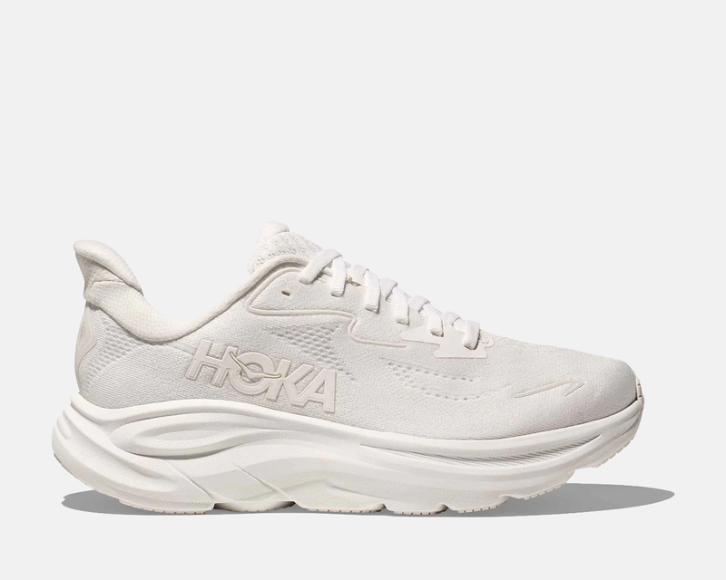 HOKA Clifton 10 running shoes in all-white featuring breathable mesh upper, cushioned midsole, and embroidered logo, side view.