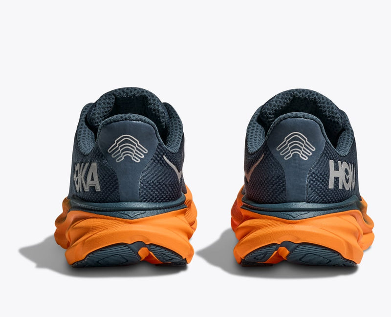 HOKA Clifton 9 GTX running shoes back view, featuring navy blue mesh upper, reflective branding, and orange cushioned midsole.