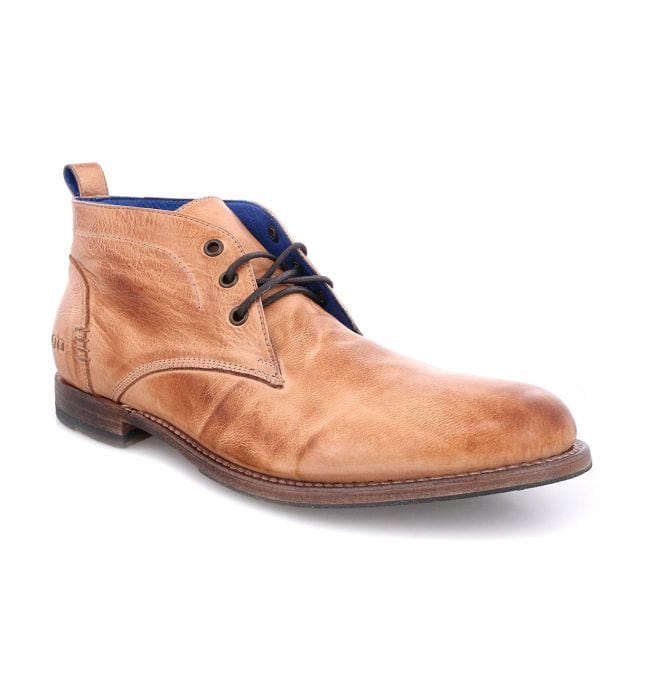 Bed Stu Clyde Chukka boots in tan leather with subtle distressing, lace-up design, and blue interior accent, side angle view.