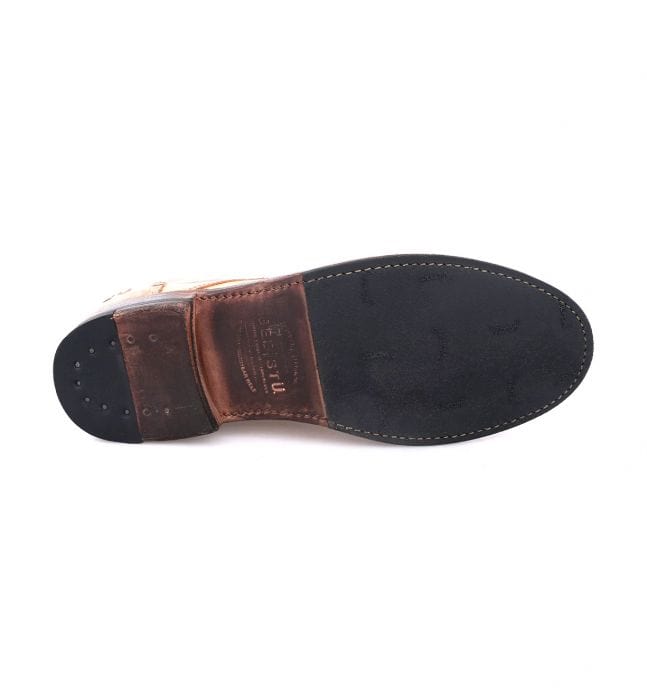 Bed Stu Clyde Chukka shoe outsole in black rubber and leather with brand engraving and stitch details, bottom view.