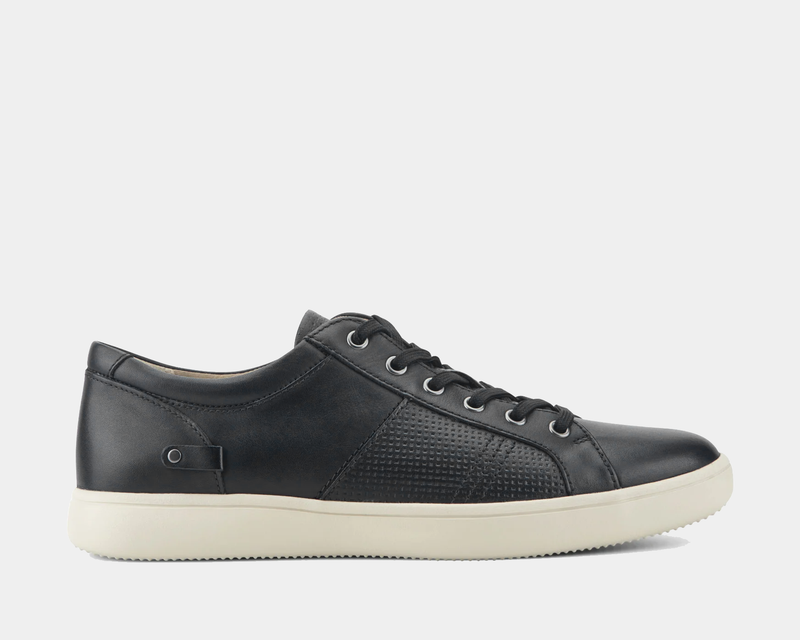 Rockport Colle Tie casual shoes in black leather with textured side panel and white rubber outsole, side view.