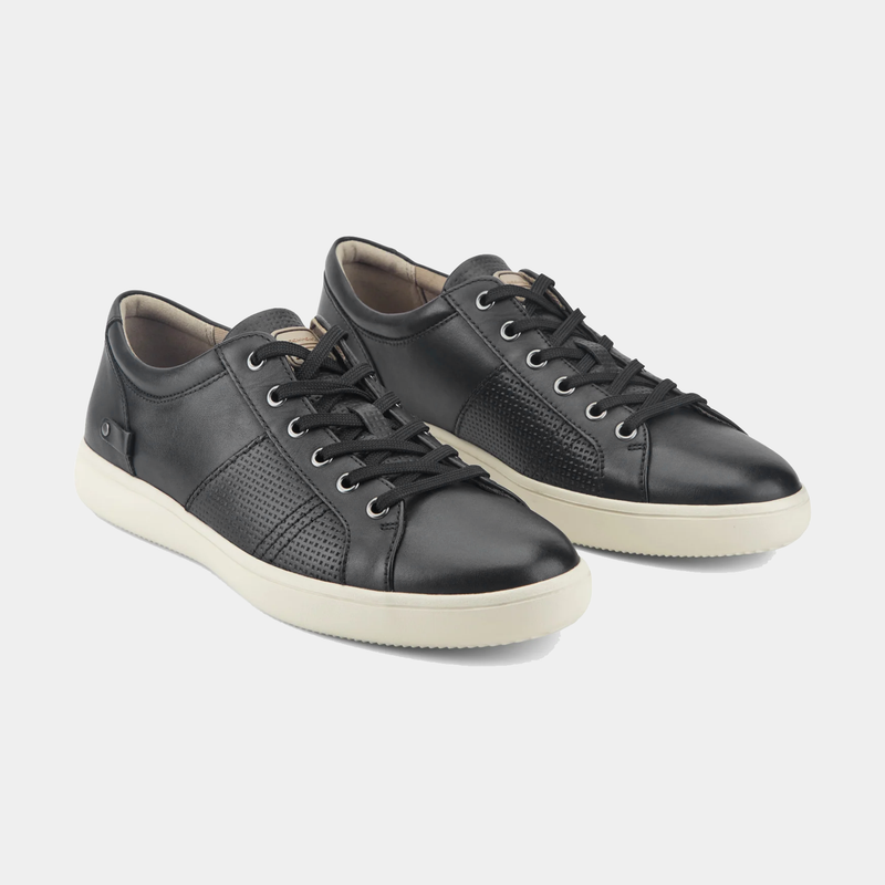 Rockport Colle Tie casual leather sneakers in black with perforated detailing, lace-up closure, and white rubber sole, angled front view.