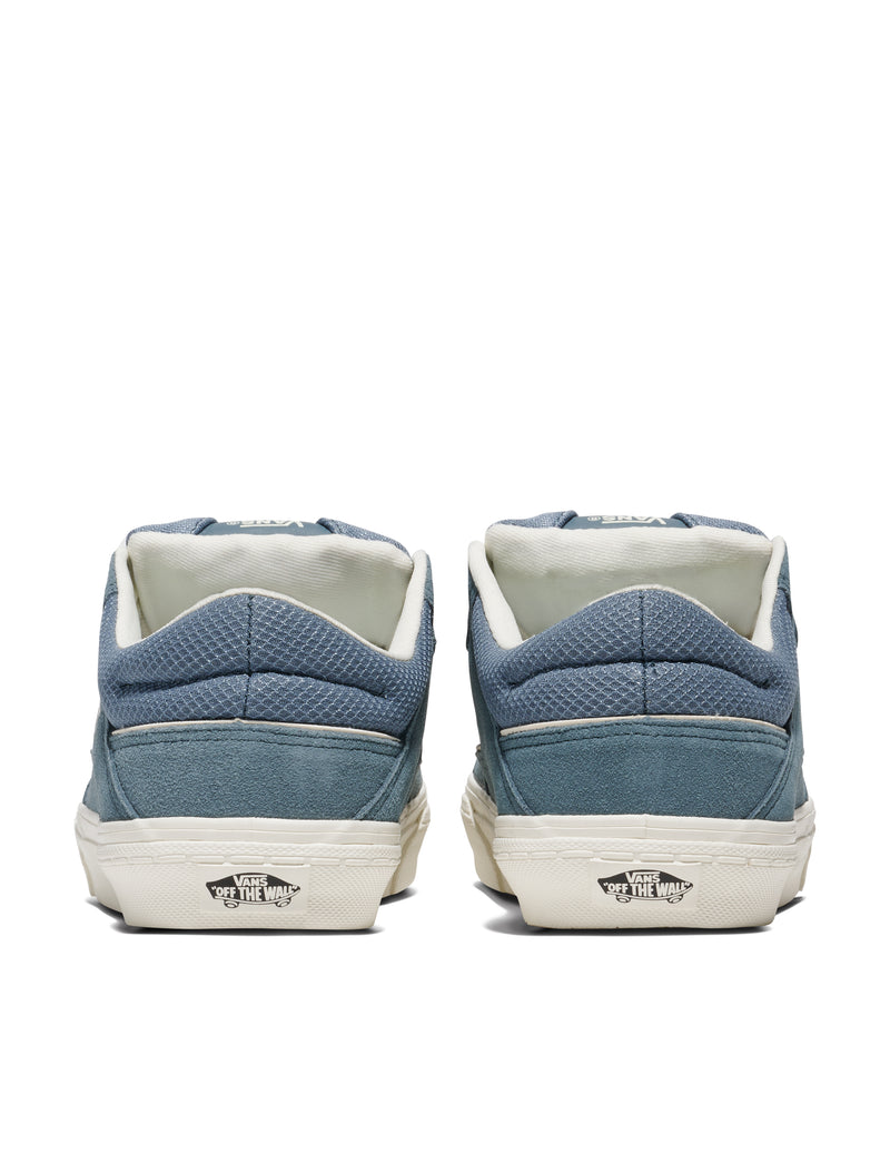 Vans Colson shoes back view showing textured blue suede and canvas upper with white sole and "Off The Wall" logo.