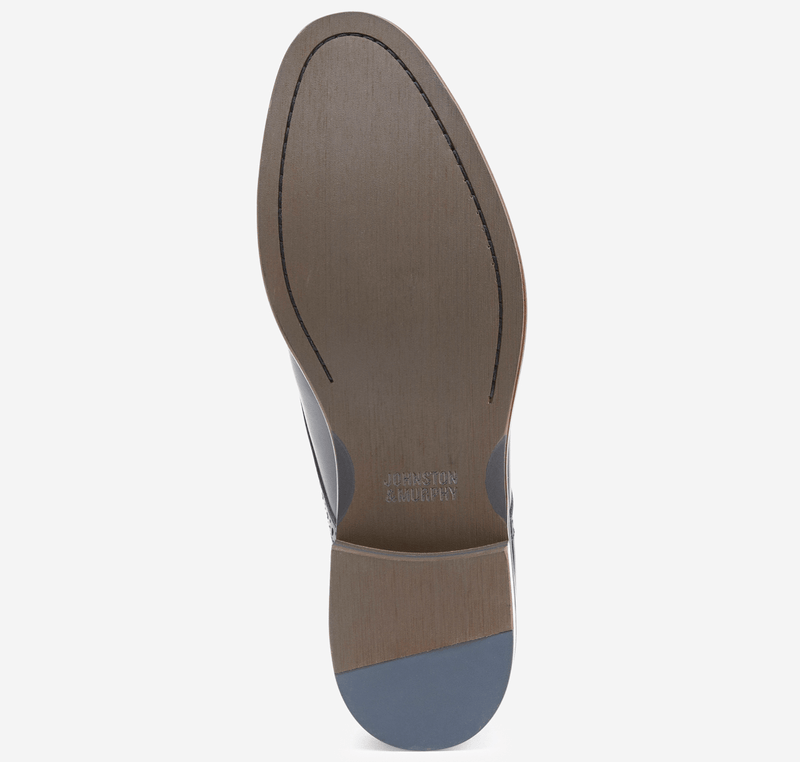 Johnston & Murphy Conard 2.0 Plain Toe dress shoe sole, brown leather outsole with engraved branding and gray rubber heel detail.