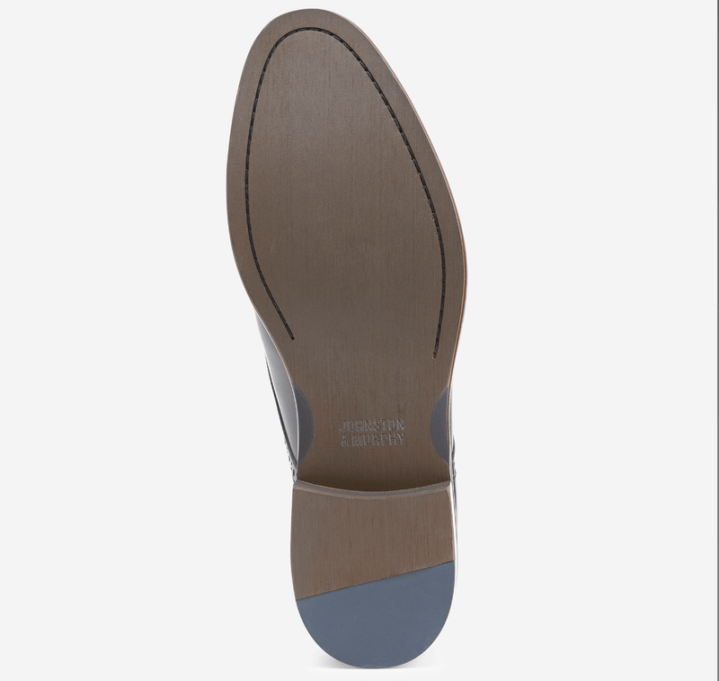 Johnston & Murphy Conard Cap Toe dress shoes sole view featuring smooth textured outsole with stitched detailing in brown