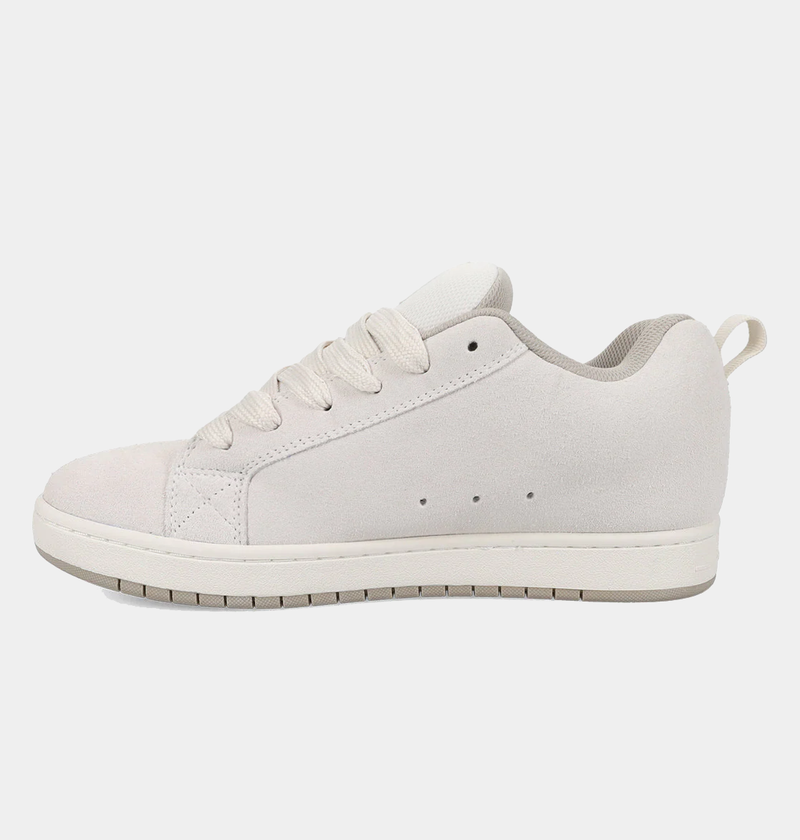 DC Footwear Court Graffik SE sneakers in light beige suede with perforations and padded collar, side view.