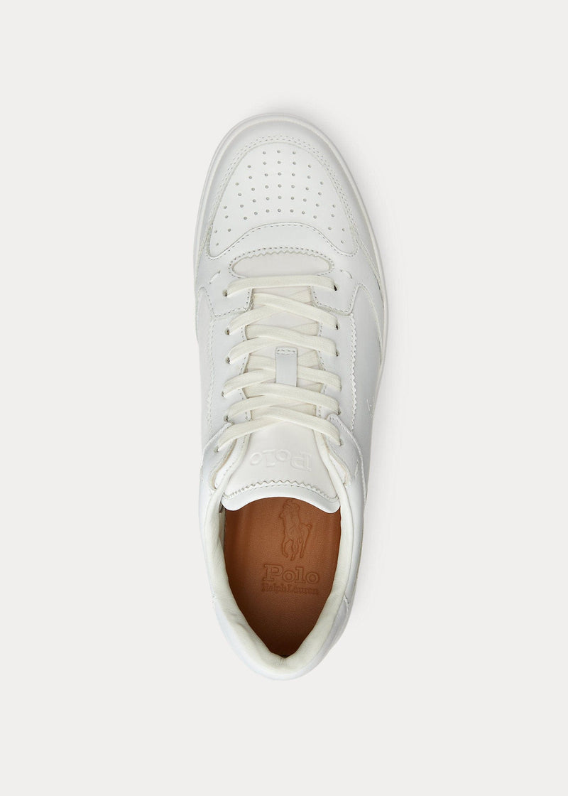 Polo Ralph Lauren Court Lux sneakers in white leather with perforated toe box, embossed logo on tongue, and tan insole, top view.