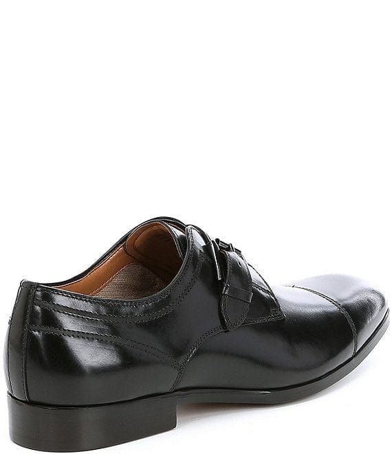 Steve Madden Covet dress shoes in black leather with cap toe design and low heel, side view showcasing buckle detailing.