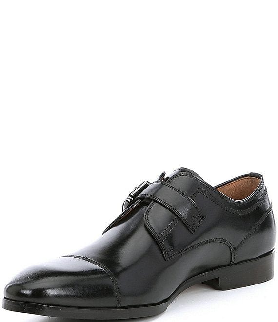 Steve Madden Covet dress shoes in black leather with sleek cap-toe design and single monk strap detail, side angle view.
