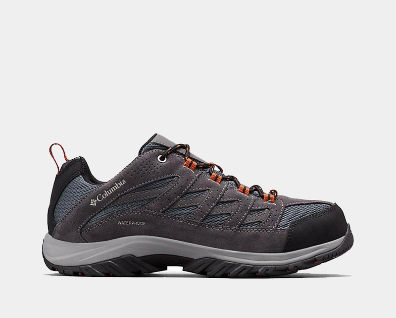 Columbia Crestwood Waterproof hiking shoes in charcoal gray with mesh panels, suede overlays, and orange lace accents, side view.