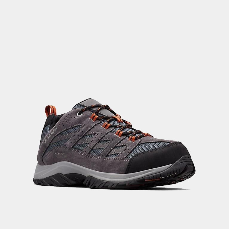 Columbia Crestwood Waterproof hiking shoes in gray with durable suede and mesh upper, orange lace accents, and rubber toe cap, side angle view.