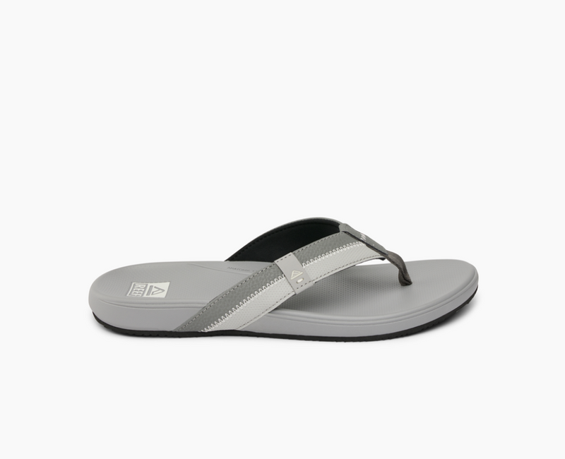 Reef Cushion Phantom 2.0 sandals in light gray with padded straps and cushioned footbed, side view.