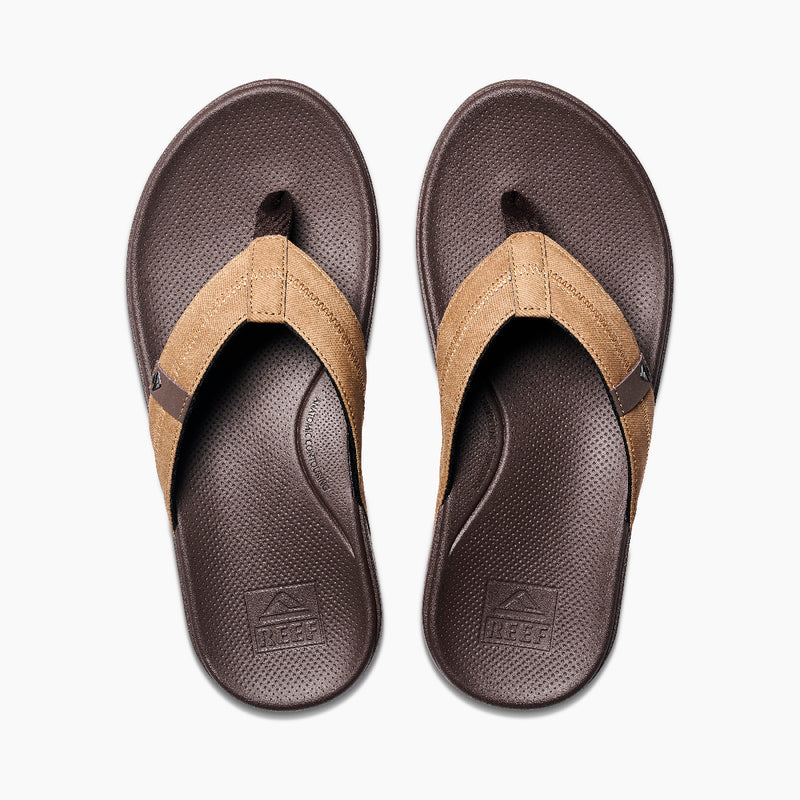 Reef Cushion Phantom 2.0 sandals in brown with tan fabric straps and textured footbed, top view.