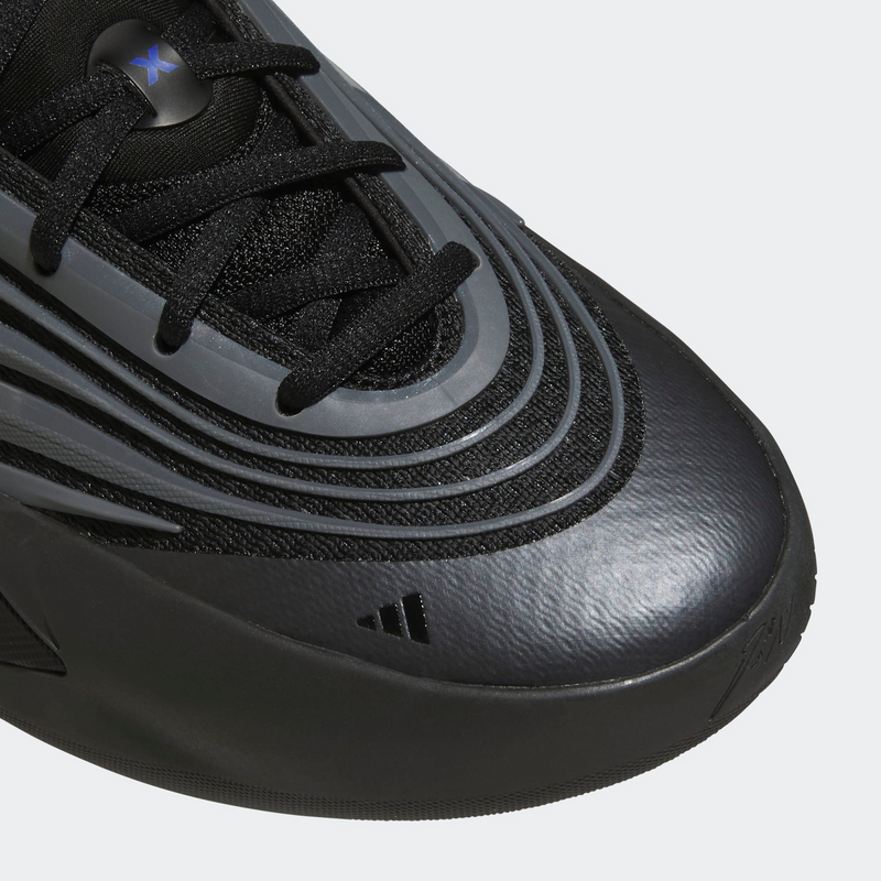 Adidas Dame X basketball shoe, black and gray with textured upper and lace detail, focus on toe box.