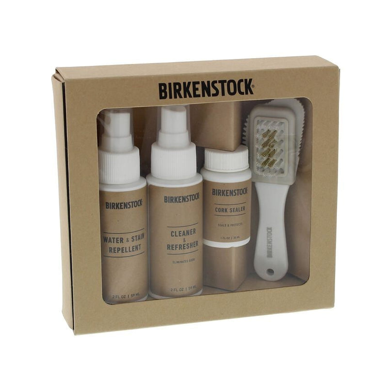 Birkenstock Deluxe Shoe Care Kit featuring water and stain repellent, cleaner and refresher, cork sealer, and brush in beige packaging, front view.