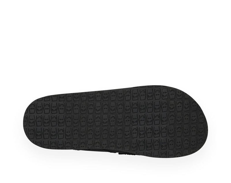 Sanuk Vagabond shoe outsole in black with textured smiley face pattern, sole/bottom view.