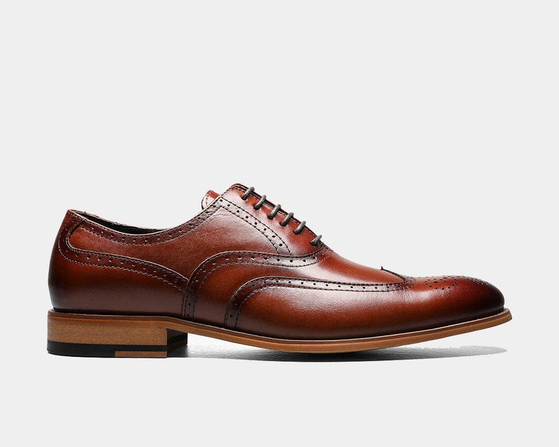 Stacy Adams Dunbar Wingtip Oxford dress shoe in rich brown leather with brogue detailing and wooden sole, side view.