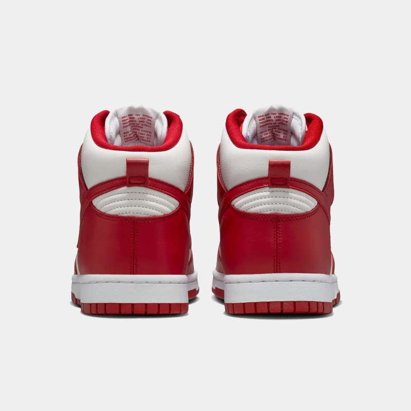Nike Dunk High Retro SE sneakers in red and white with padded collar and textured leather, back view.