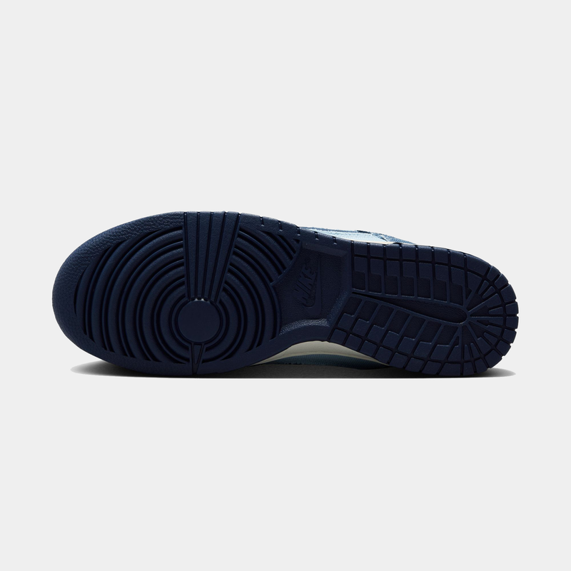 Nike Dunk Low Retro SE sneakers outsole in navy blue rubber with circular tread pattern and Nike branding