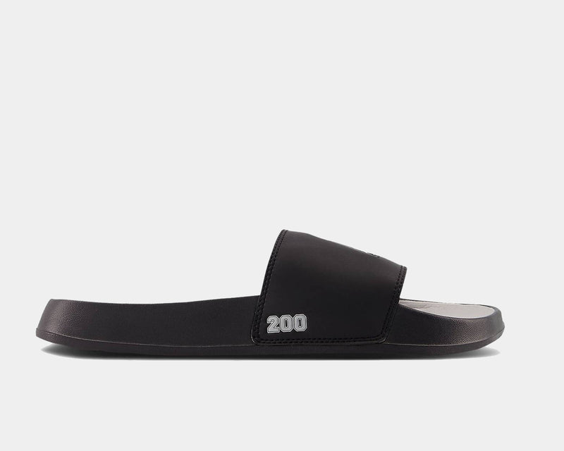 New Balance DynaSoft 200v2 VRSTY slide sandals in black with cushioned footbed, side view.