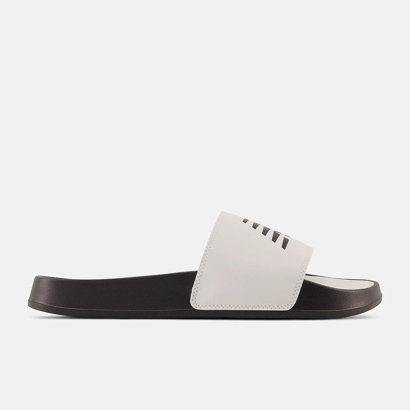 New Balance DynaSoft 200v2 slide sandals in white with black sole and cushioned footbed, side view.