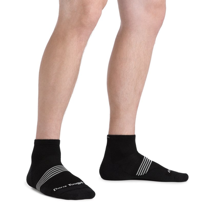 Darn Tough Element Quarter Lightweight Running Sock in black with white logo and stripe details, worn lifestyle view.